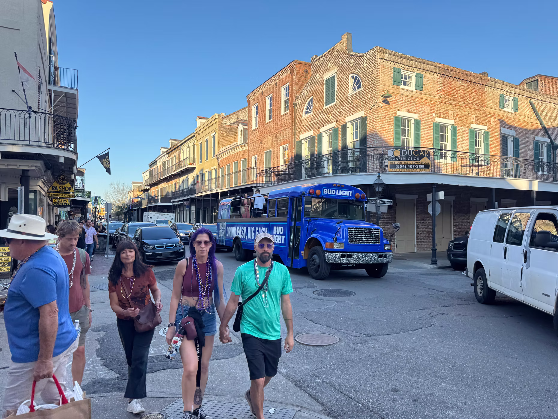 Wedding guests boarding a white trolley